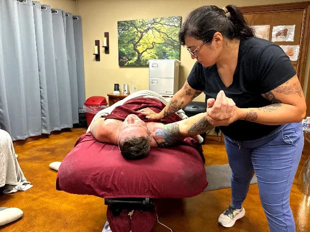 Diana working with a client in the Fair Oaks Massage treatment room